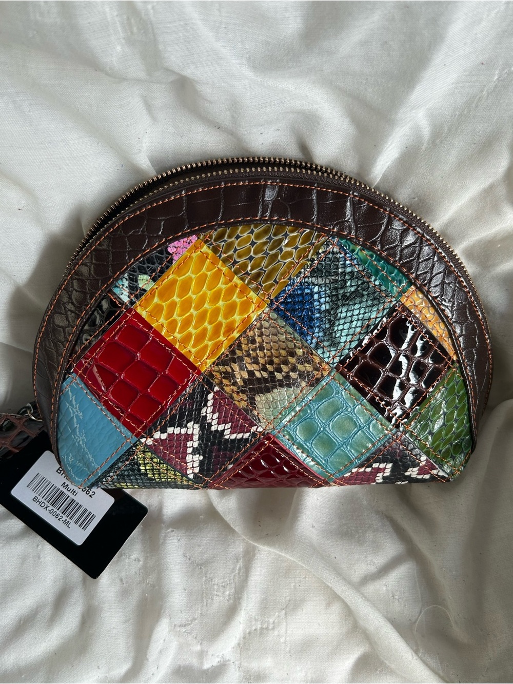 Genuine leather patchwork set of 4 cosmetic cases.